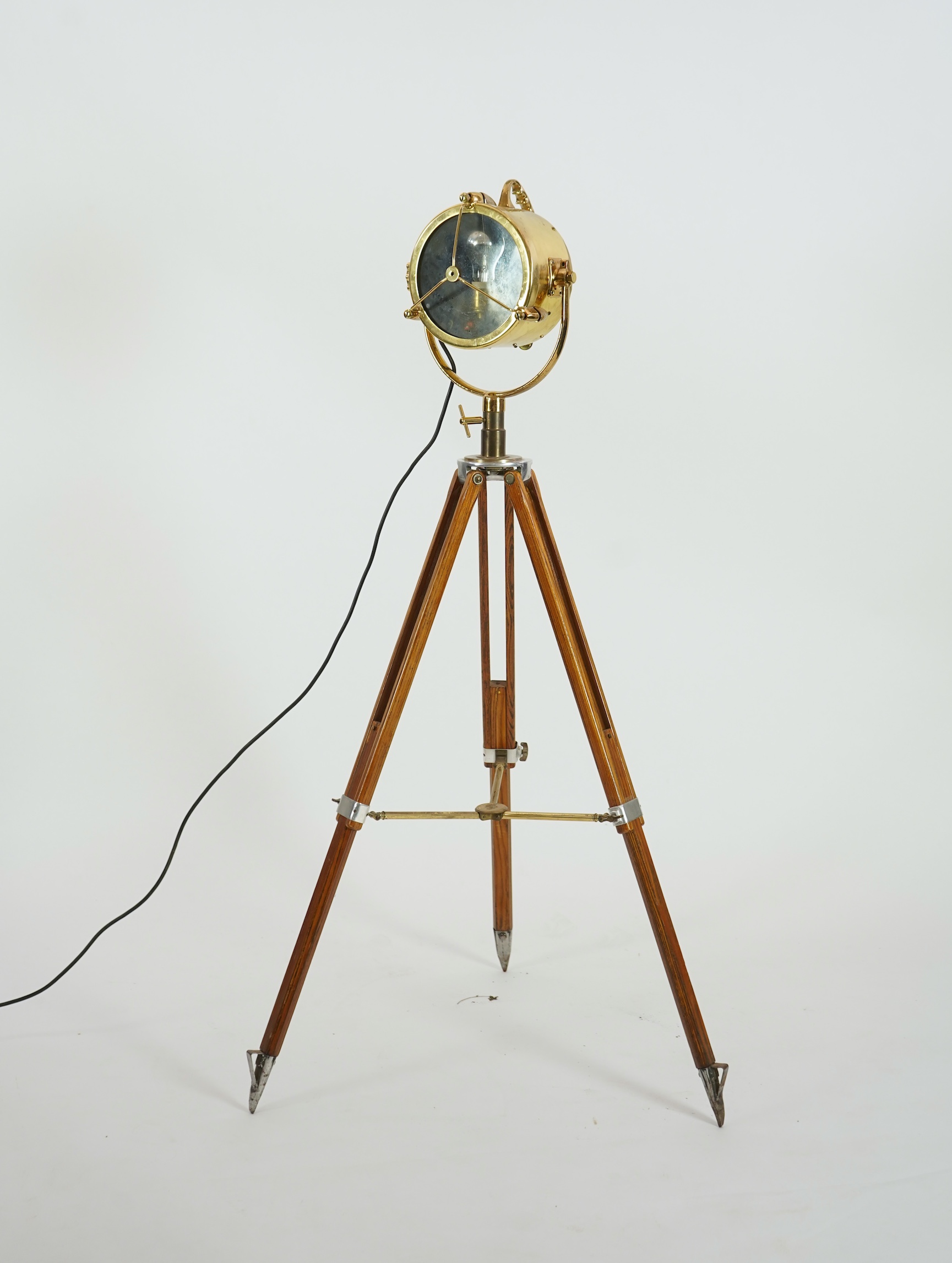 A mid 20th century polished brass marine searchlight